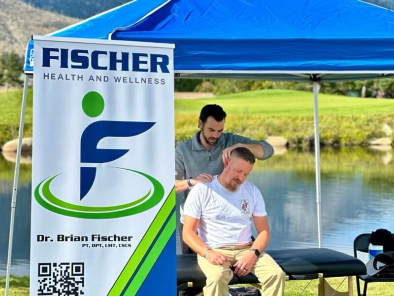 Brian Fischer with physical therapy team in clinic, Reno NV